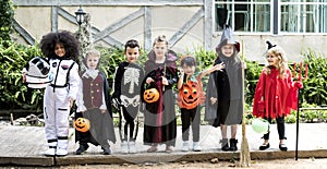 Diverse kids in Halloween costumes photo