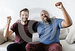 Diverse Men cheering sport together