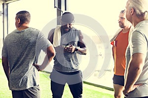 Diverse men having training at gym