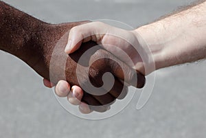 Diverse men shaking hands