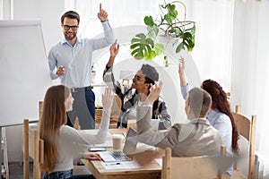 Diverse millennial employees engaged in teambuilding activity