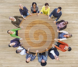 Diverse Multiethnic People Holding Hands Indoors.