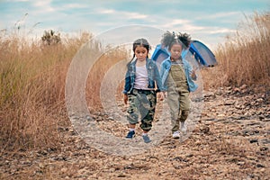 Diverse people of asian and african american children having fun walking and playing together in natural park