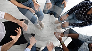 Diverse people group sitting in circle on mental therapy session