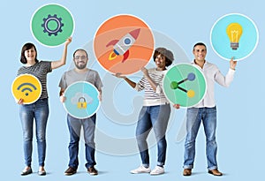 Diverse people holding technology icons