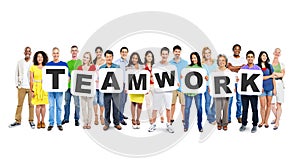 Diverse People Holding Word Teamwork