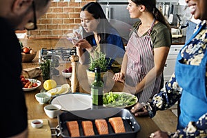 Diverse people joining cooking class