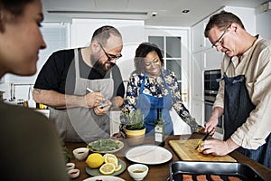 Diverse people joining cooking class