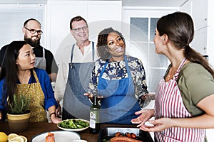 Diverse people joining cooking class