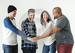 Diverse people joining hands together teamwork and community concept