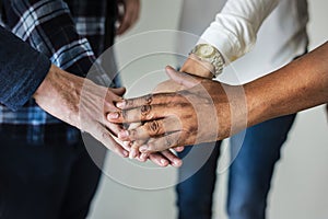 Diverse people joining hands together teamwork and community concept