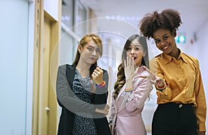 Diverse people pride community with rainbow Stretch Wristband. Diverse friends celebrating lesbian pride LGBTQ community concept.