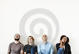 Diverse people sitting with thoughtful face expression