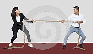 Diverse people tugging on a rope