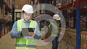 Diverse people in uniform making inspection on storehouse