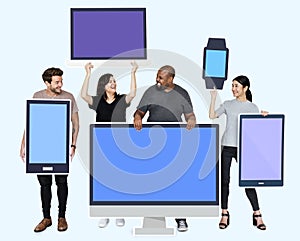 Diverse people with various mockup of digital devices