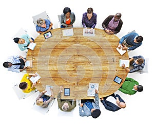 Diverse People Working Around the Conference Table