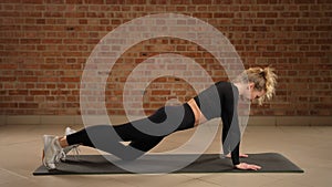 Diverse plank variations for full core development by gym trainer