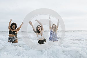 Diverse plus size women having fun in the water