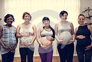 Diverse pregnant women in maternity class