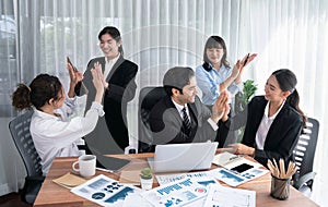 Diverse race office worker celebrate after made progress. Habiliment