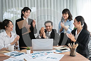 Diverse race office worker celebrate after made progress. Habiliment