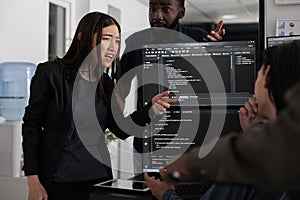 Diverse software developers analyzing html code and database