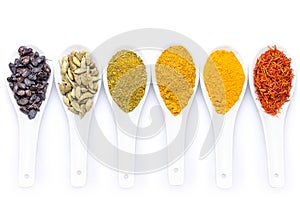 Diverse of spices in a spoon isolated on white background