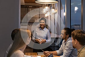 Diverse startup business team gathered together in modern office boardroom