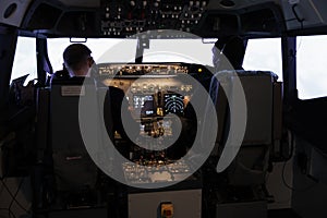 Diverse team of aircrew members using control command to fly plane