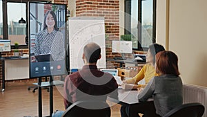 Diverse team attending business meeting on video conference