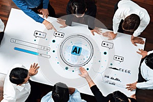 Diverse team collaborating around a table brainstorming ideas about artificial intelligence and technology with visual