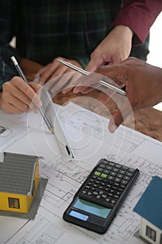 Diverse Team of Specialists Use Laptop on Construction Site. Real Estate Building Project with Engineer Investor and Businessman