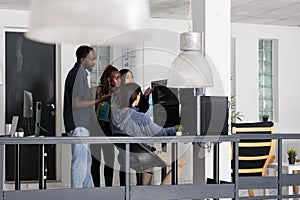 Diverse team of web developer analyzing html code on terminal window,
