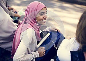 Diverse teens spending time outdoors photo