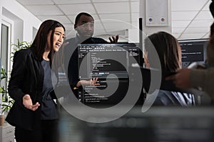 Diverse web developers collaborating about programming project