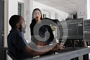 Diverse web developers working on software development with source code