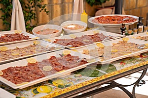 a diverse wedding buffet featuring both meat, seafood, and desserts