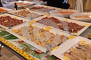 a diverse wedding buffet featuring both meat, seafood, and desserts