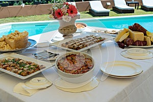 a diverse wedding buffet featuring both meat, seafood, and desserts