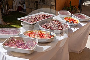 a diverse wedding buffet featuring both meat, seafood, and desserts