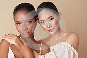 Diverse. Women Beauty Portrait. Multi-Ethnic Models With Natural Makeup And Perfect Skin Against Beige Background.