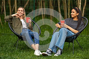 Diverse women friends enjoying spring picnic spending weekend