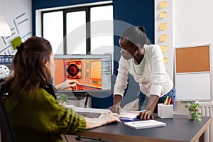 Diverse women game sofware developers testing new game