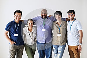 Diverse workers standing together smiling