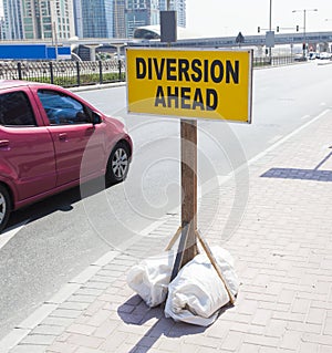 diversion ahead sign in traffic. photo