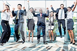 Diversity business team jumping celebrating success