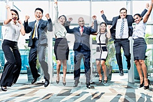 Diversity business team jumping celebrating success photo