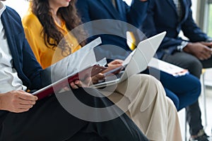 Diversity candidates siting while waiting for job interview. Intellectual.