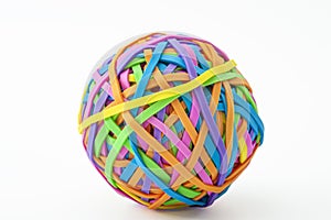 Diversity and complexity conceptual idea with multicoloured rubber band ball made of mixed coloured strip bands isolated on white photo